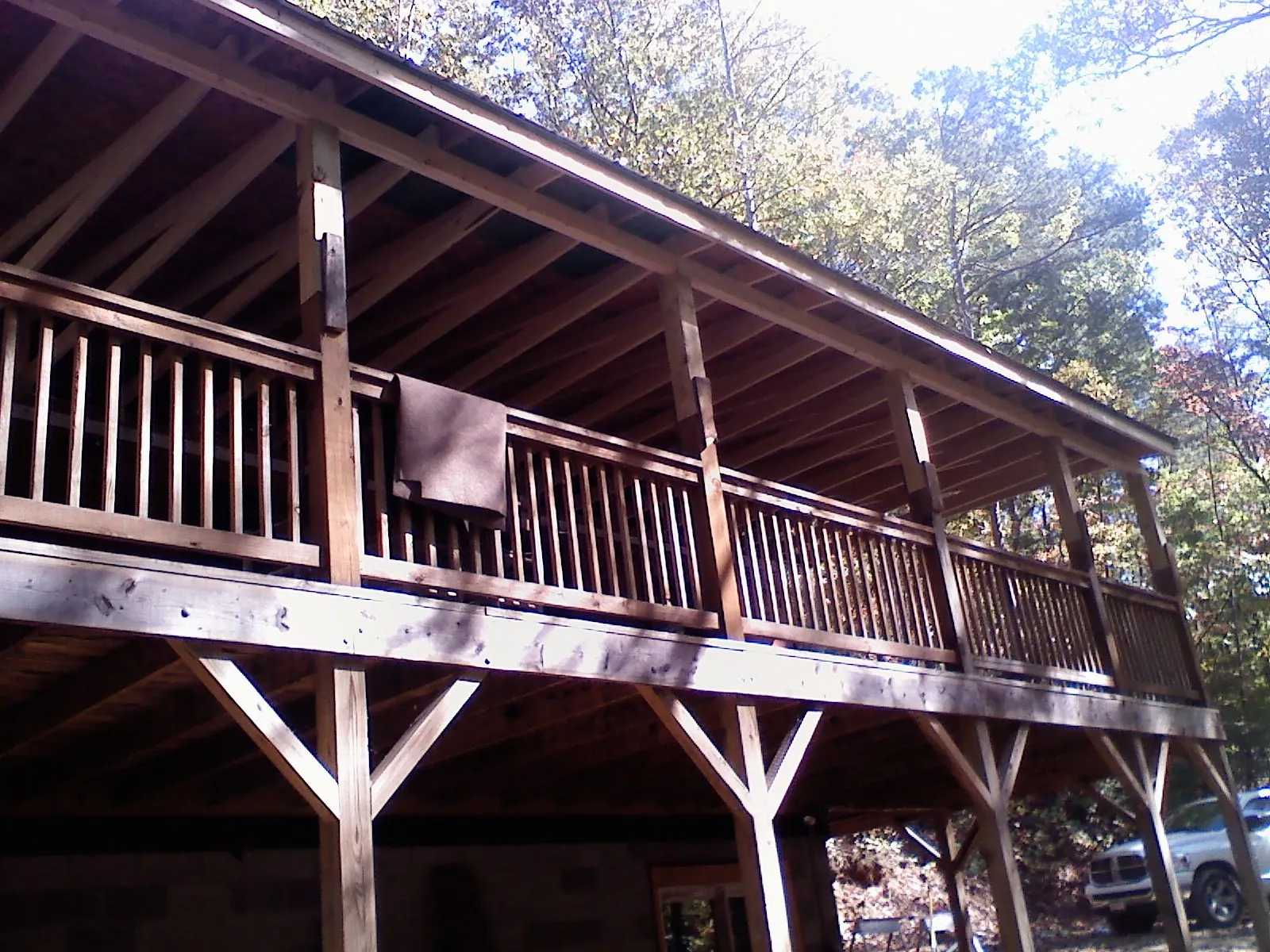 Timber framing under a new elevated porch and deck — Roof Leak Repair in Whitefield by Roofing Brothers